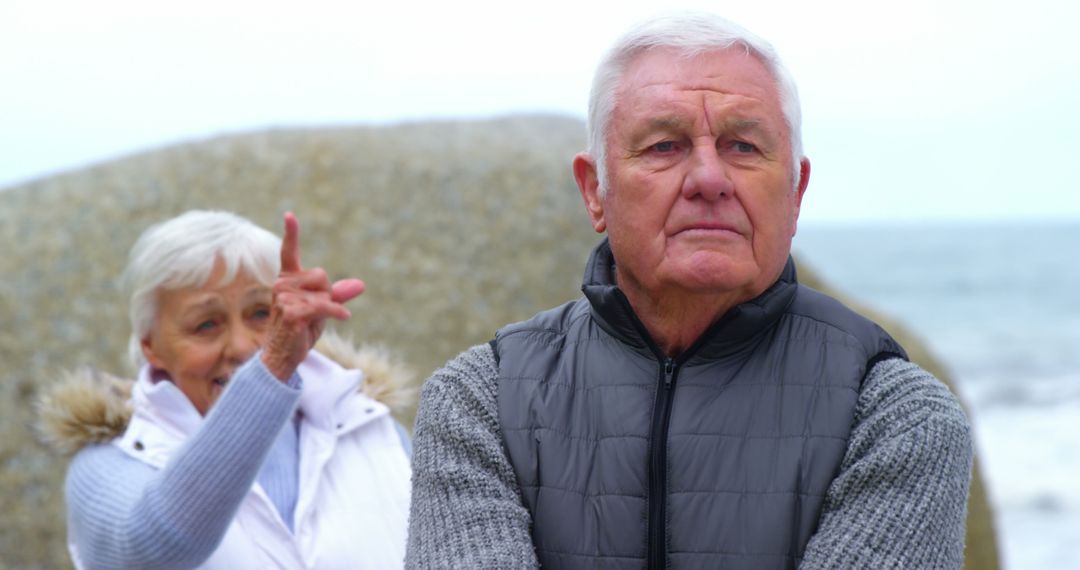 Elderly Couple Having Disagreement By The Beach - Free Images, Stock Photos and Pictures on Pikwizard.com