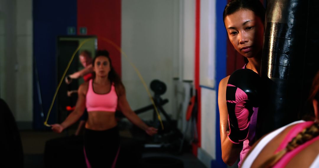 Women Exercising in Gym with Skipping Rope and Punching Bag - Free Images, Stock Photos and Pictures on Pikwizard.com