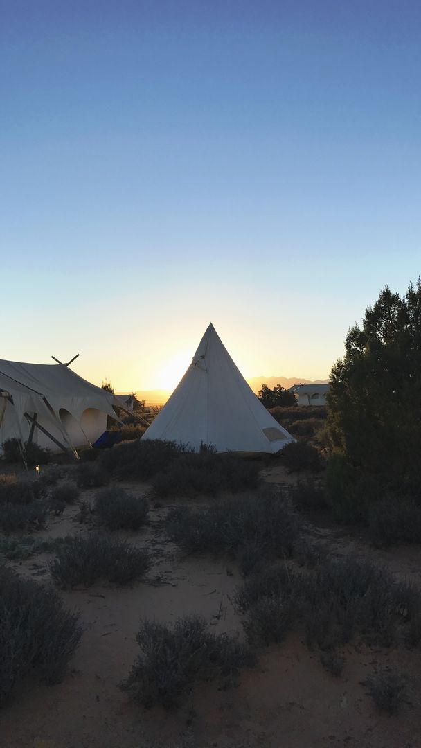 Serene Sunset over Tipi Tent in Desert Landscape - Free Images, Stock Photos and Pictures on Pikwizard.com