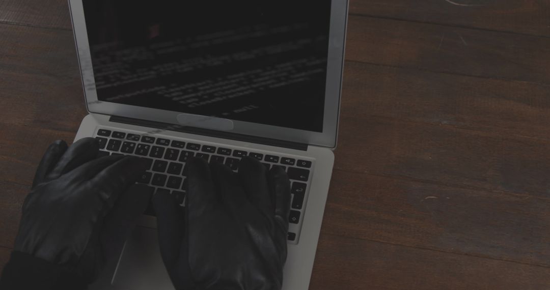 Cybersecurity and Data Protection Concept with Laptop and Gloves