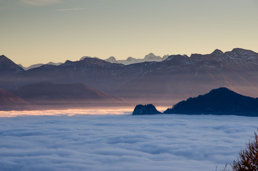 Mountain Range Over Cloud Layer During Sunrise - Free Images, Stock Photos and Pictures on Pikwizard.com