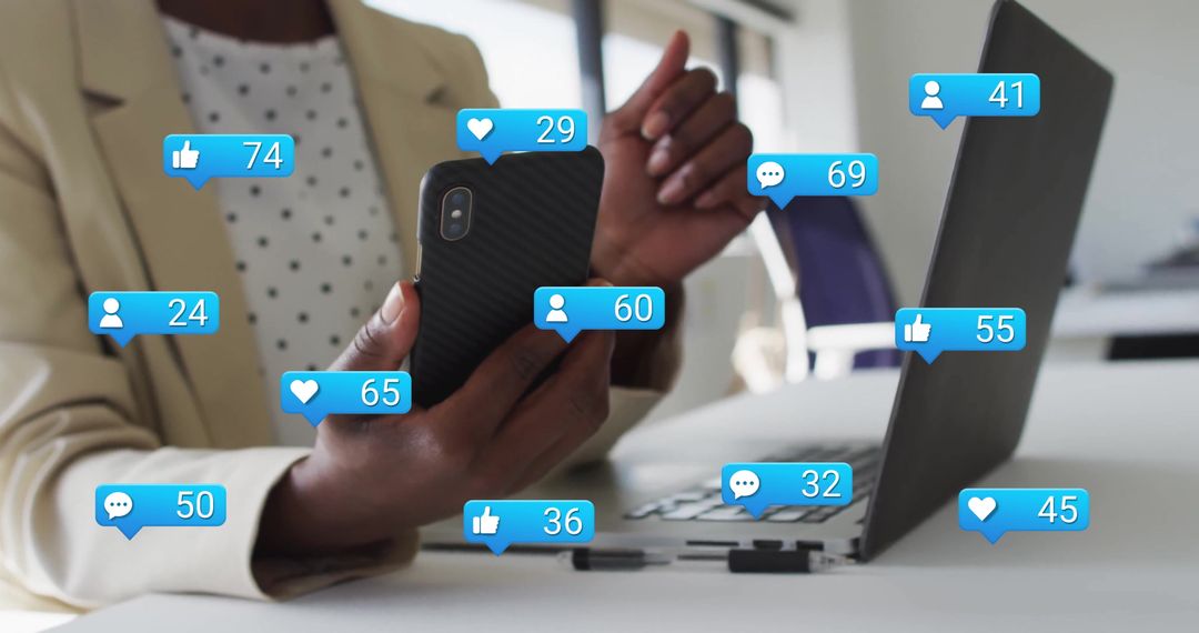 Hands Receiving Social Media Alerts in Office Workspace