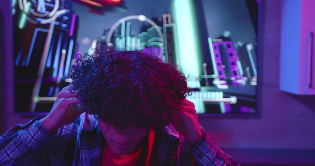 Gamer Immersed in Virtual Neon World with Headphones On