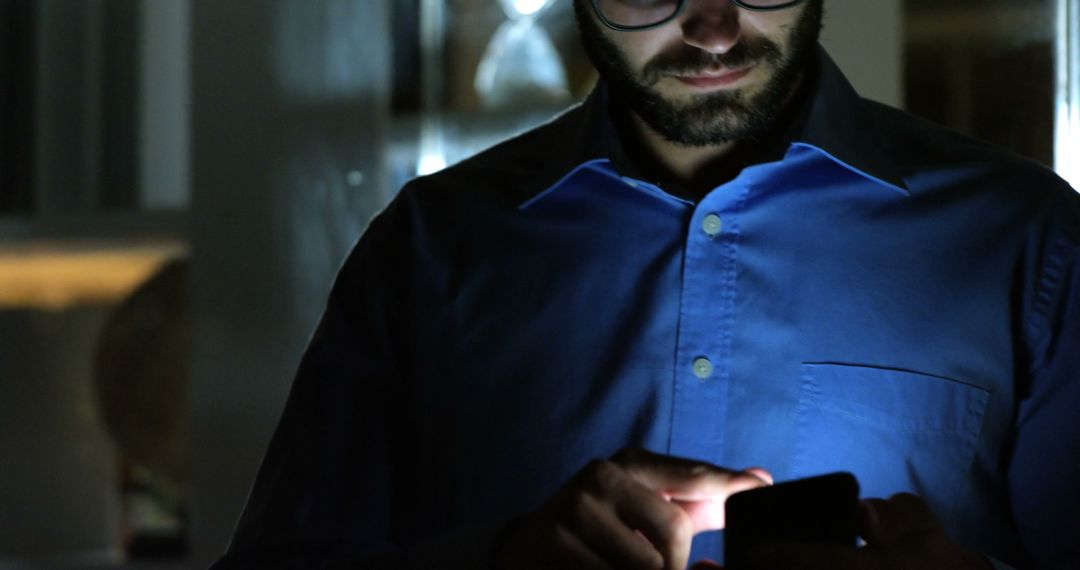 Man Using Smartphone in Low Light Indoors - Free Images, Stock Photos and Pictures on Pikwizard.com