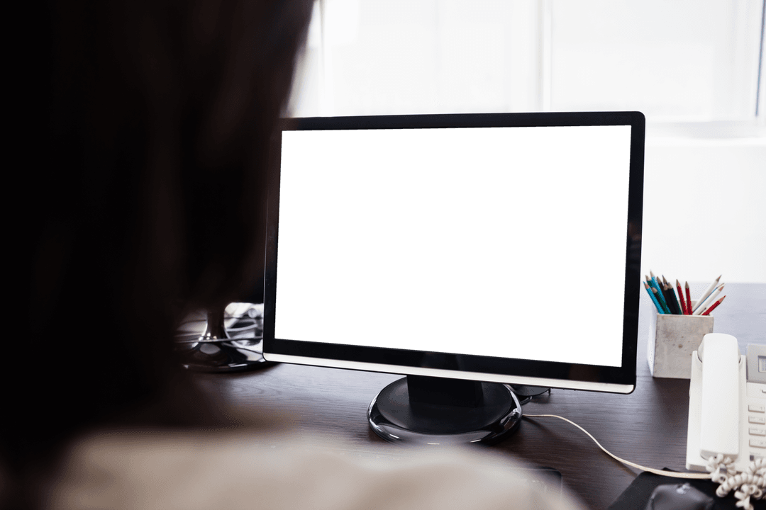 Woman Working at Desk with Transparent Computer Screen