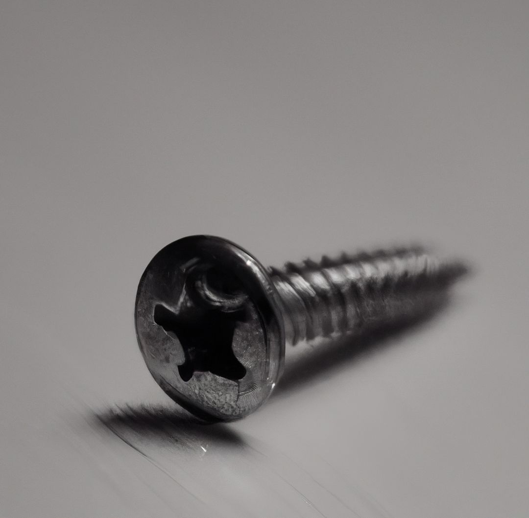 Close-Up of a Metal Screw on White Background - Free Images, Stock Photos and Pictures on Pikwizard.com