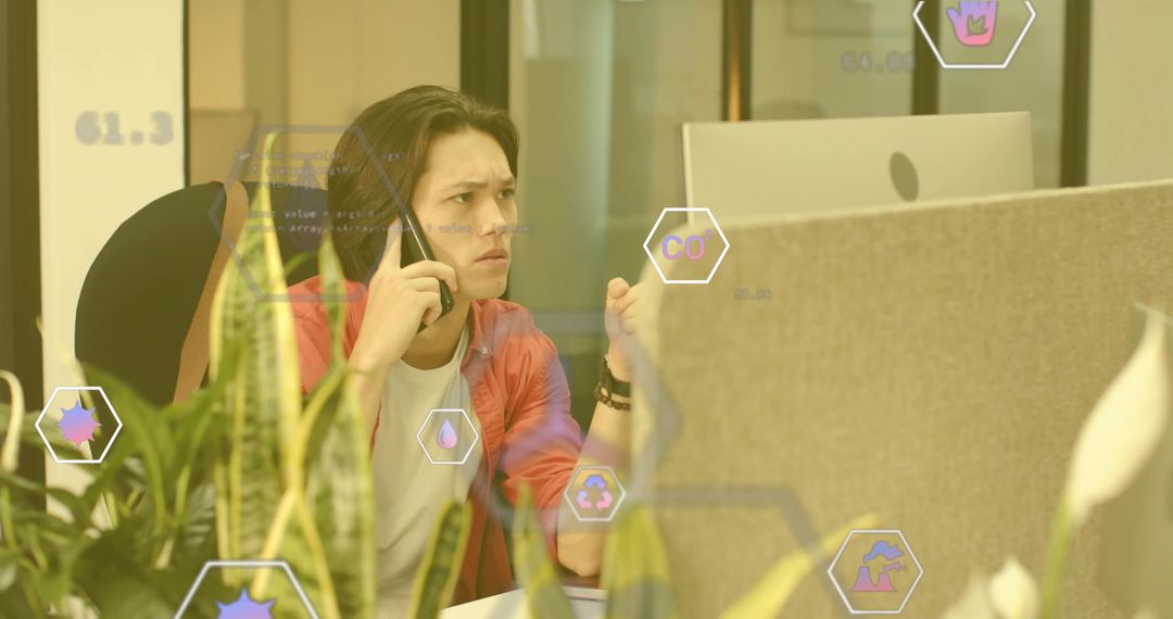Frustrated Office Worker on Call with Digital Icons and Greenery