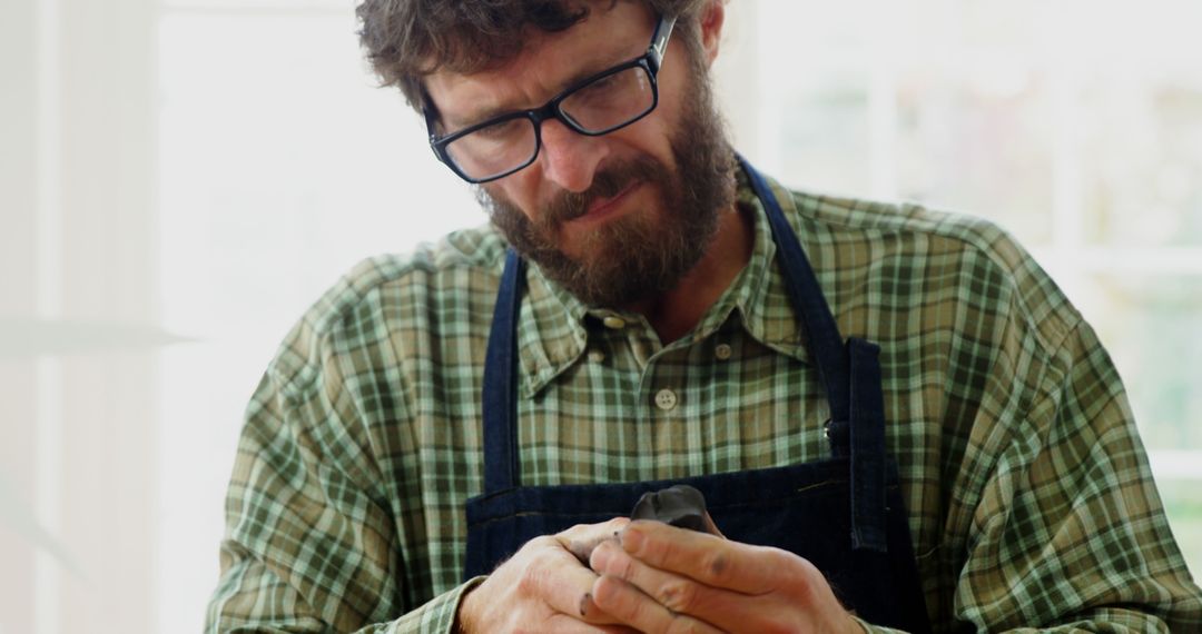 Bearded Artisan in Plaid Shirt Sculpting - Free Images, Stock Photos and Pictures on Pikwizard.com