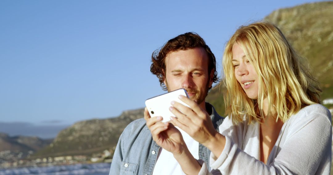 Couple Taking Selfie Outdoors Near Mountain Scenery - Free Images, Stock Photos and Pictures on Pikwizard.com