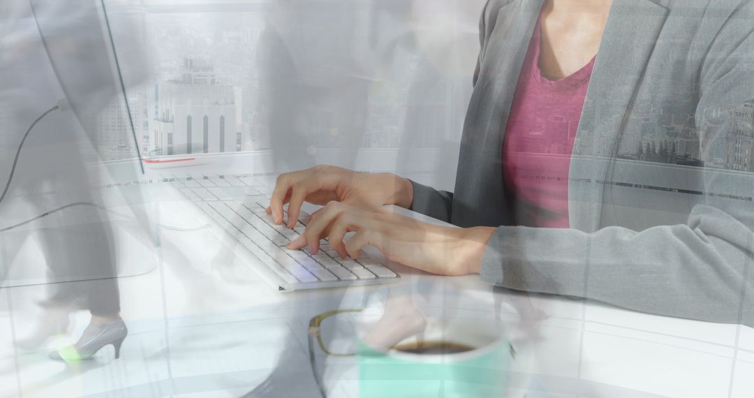 Businesswoman Typing on Computer Keyboard in Modern Office - Free Images, Stock Photos and Pictures on Pikwizard.com