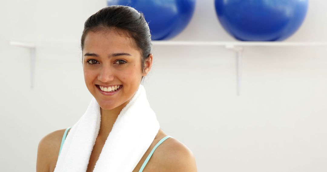 Young Woman Smiling After Workout Holding Towel - Free Images, Stock Photos and Pictures on Pikwizard.com