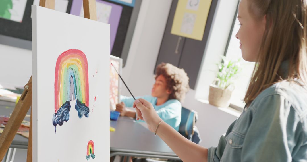 Diligent Girl Painting Rainbow on Canvas During Art Class - Free Images, Stock Photos and Pictures on Pikwizard.com