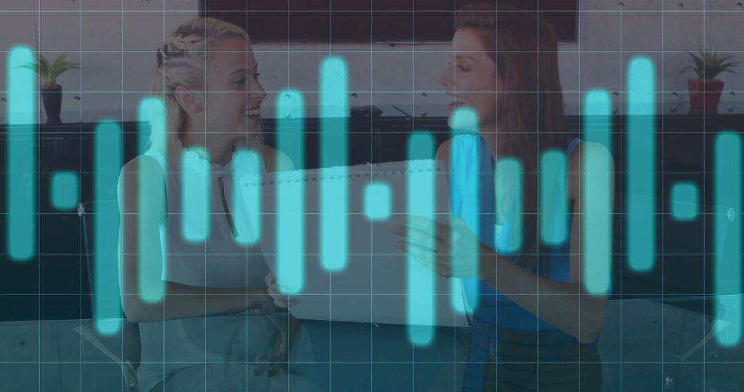 Two Women Collaborating with Business Graph Overlay Technology