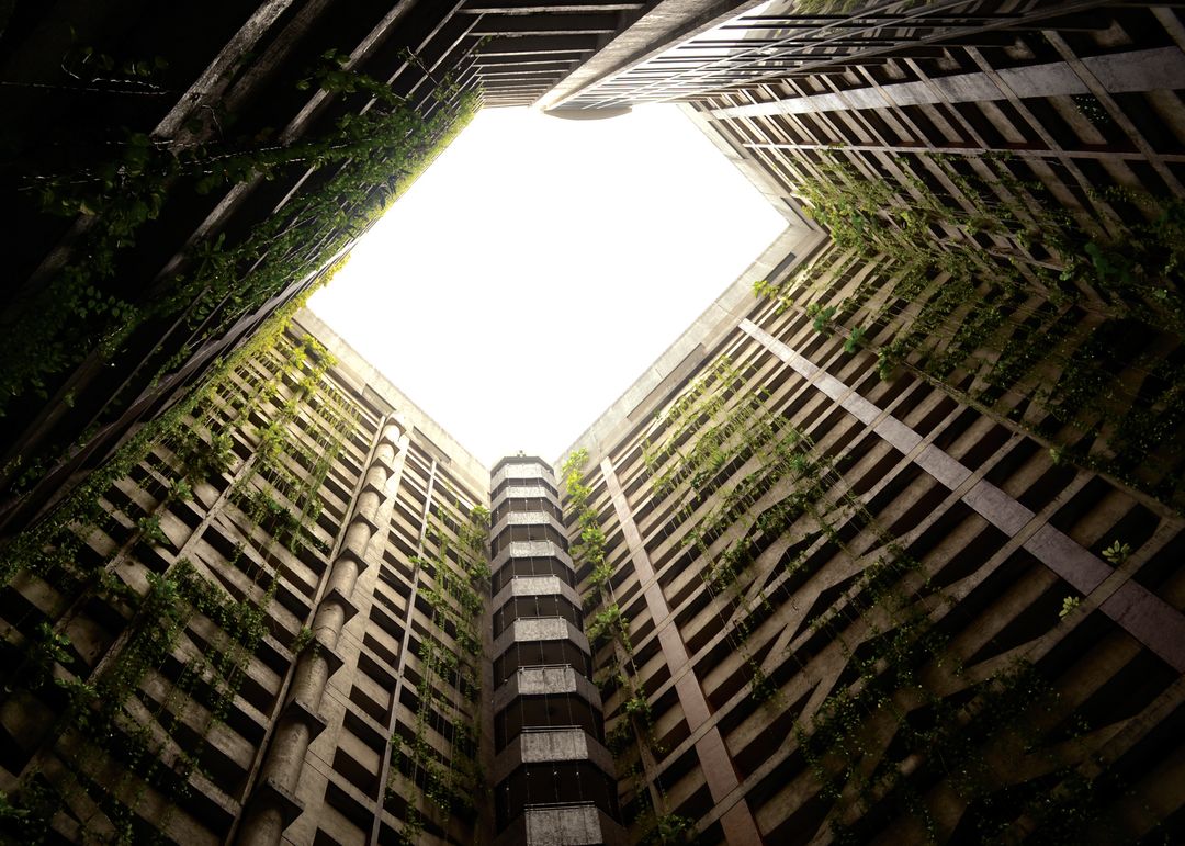 Top View of Abandoned Highrise Building with Green Overgrowth - Free Images, Stock Photos and Pictures on Pikwizard.com