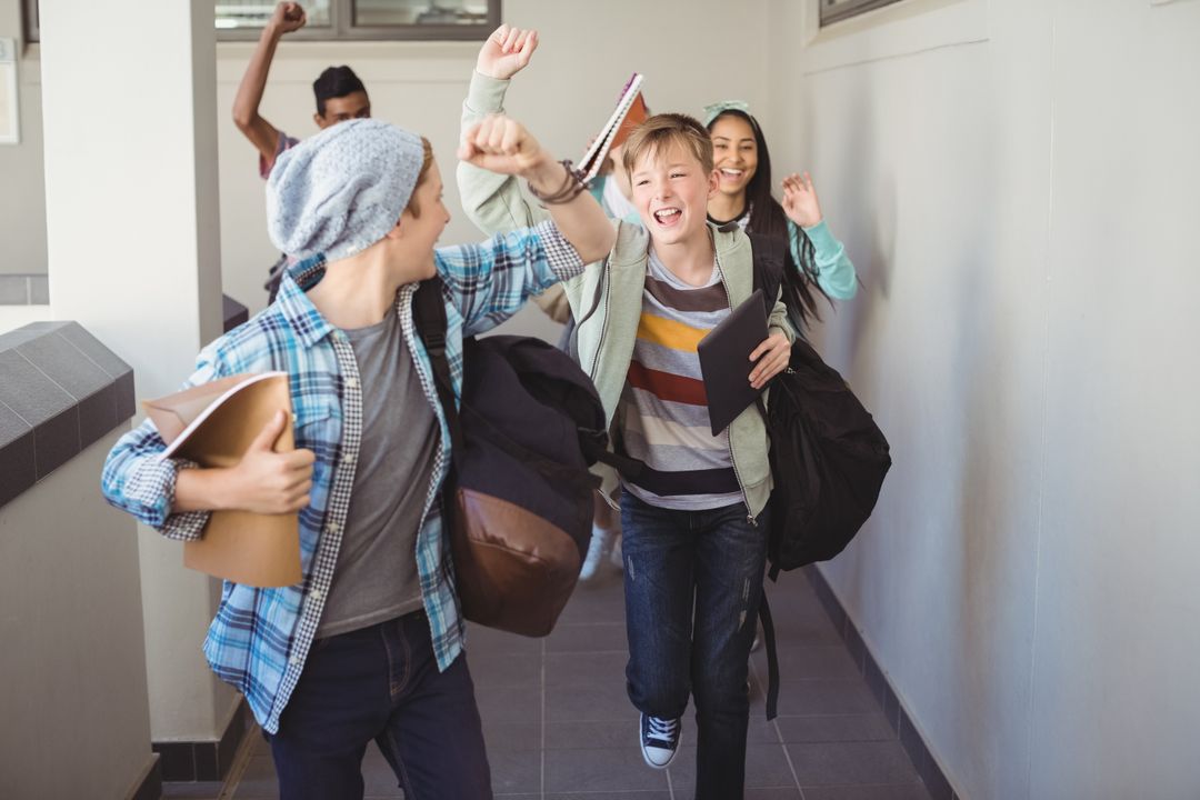 Group of classmate running in corridor  - Free Images, Stock Photos and Pictures on Pikwizard.com