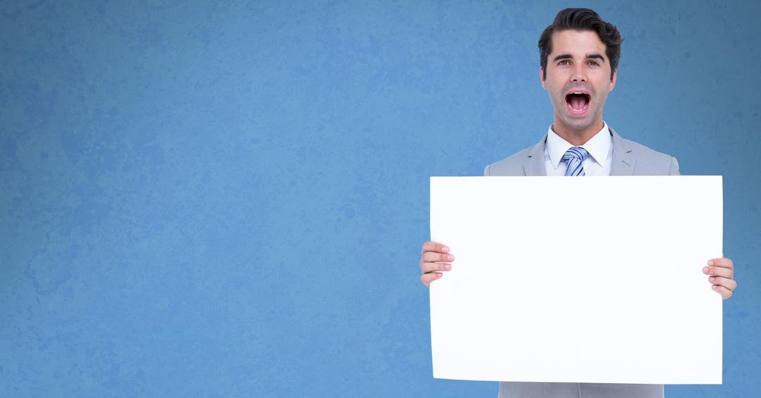Businessman screaming while holding bill board - Free Images, Stock Photos and Pictures on Pikwizard.com