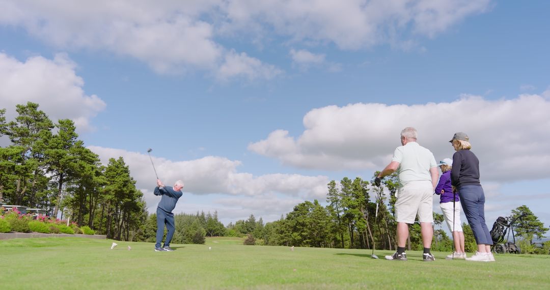 Senior Friends Enjoying Game of Golf in Scenic Setting