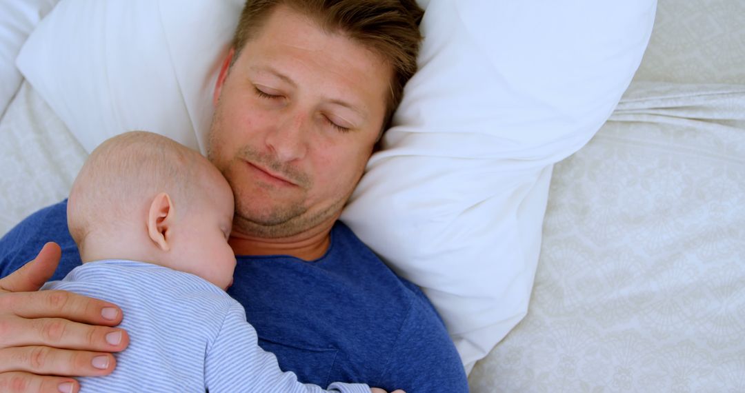 Father and Infant Sleeping Together Highlighting Bond - Free Images, Stock Photos and Pictures on Pikwizard.com