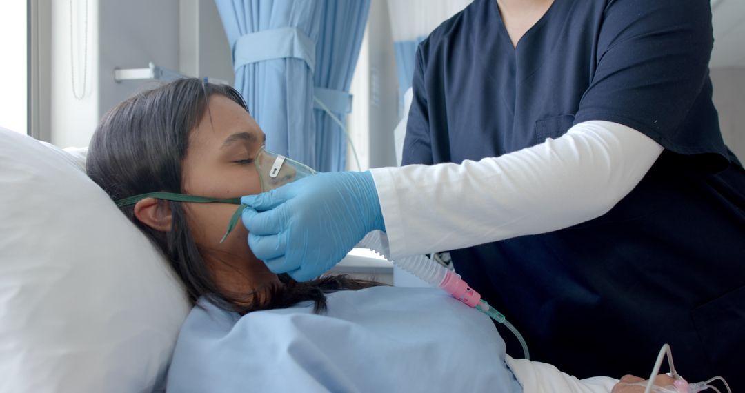 Female Doctor Assisting Patient with Oxygen Mask