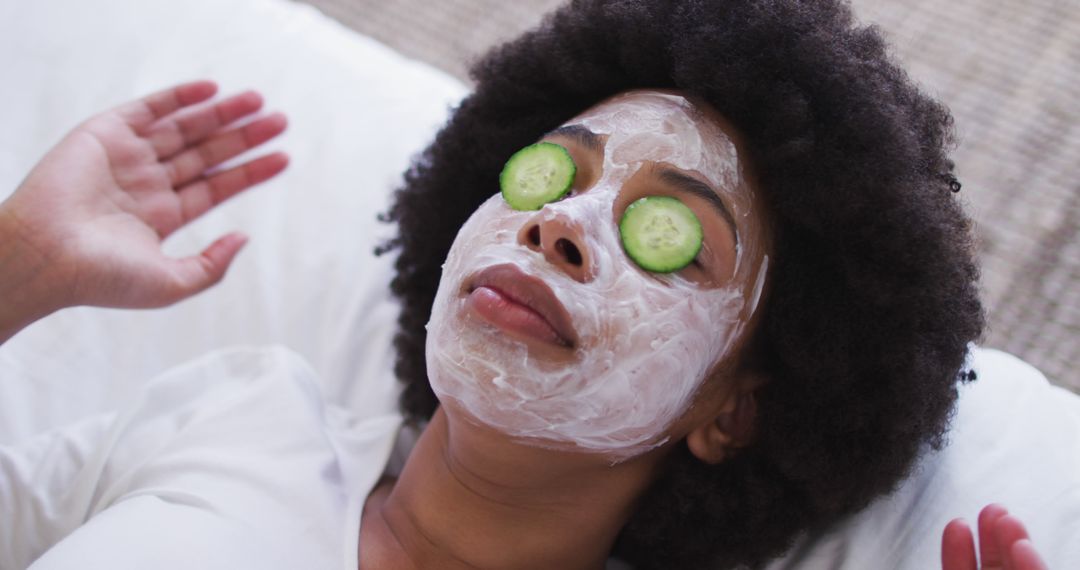 Close up of african american woman wearing face mask laying on the bed - Free Images, Stock Photos and Pictures on Pikwizard.com