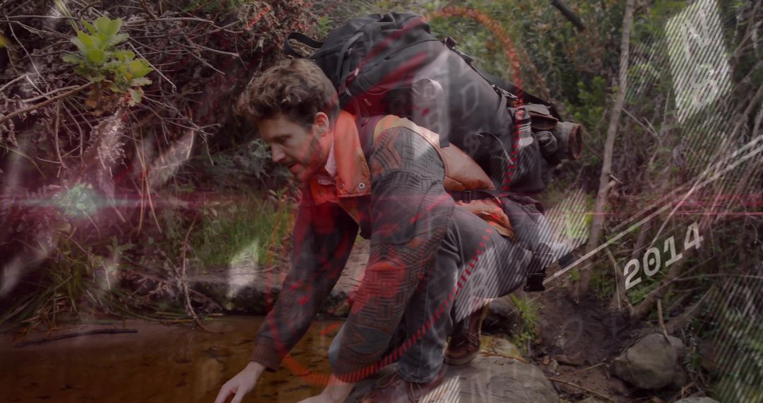 Hiker Gathering Water from Creek in Forest Adventure Exploration