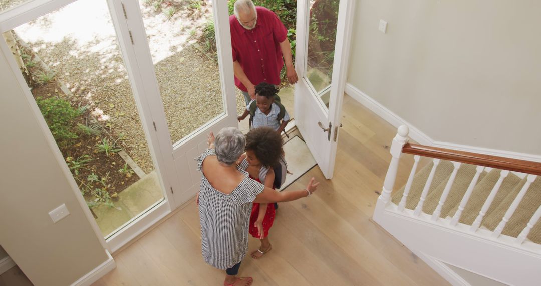 Grandparents Welcoming Grandchildren into House Entrance - Free Images, Stock Photos and Pictures on Pikwizard.com