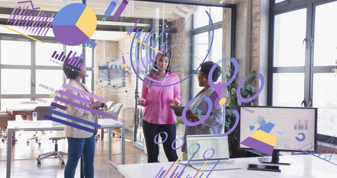 Businesswomen Discussing Data Trends with Collaborative Technology Interface