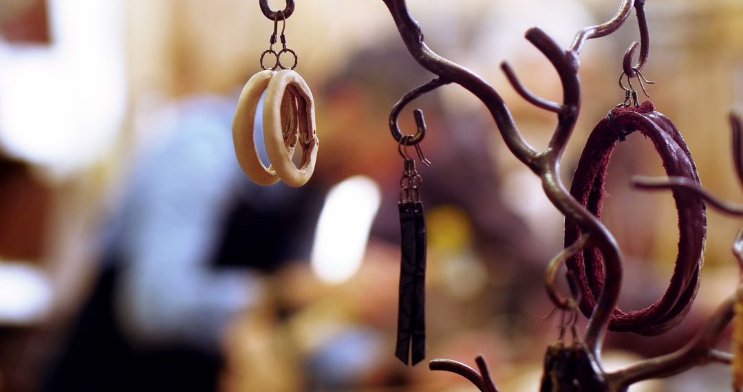 Artistic Display of Handmade Earrings on Tree Branch Stand - Free Images, Stock Photos and Pictures on Pikwizard.com