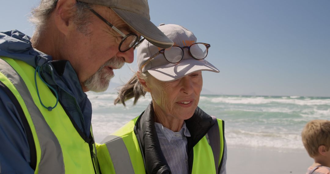 Senior Environmental Volunteers Surveying Beach - Free Images, Stock Photos and Pictures on Pikwizard.com