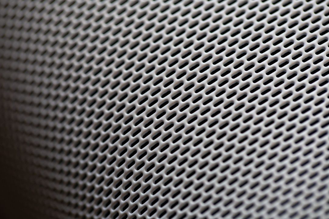 Close-Up of Gray Speaker Grill Texture
