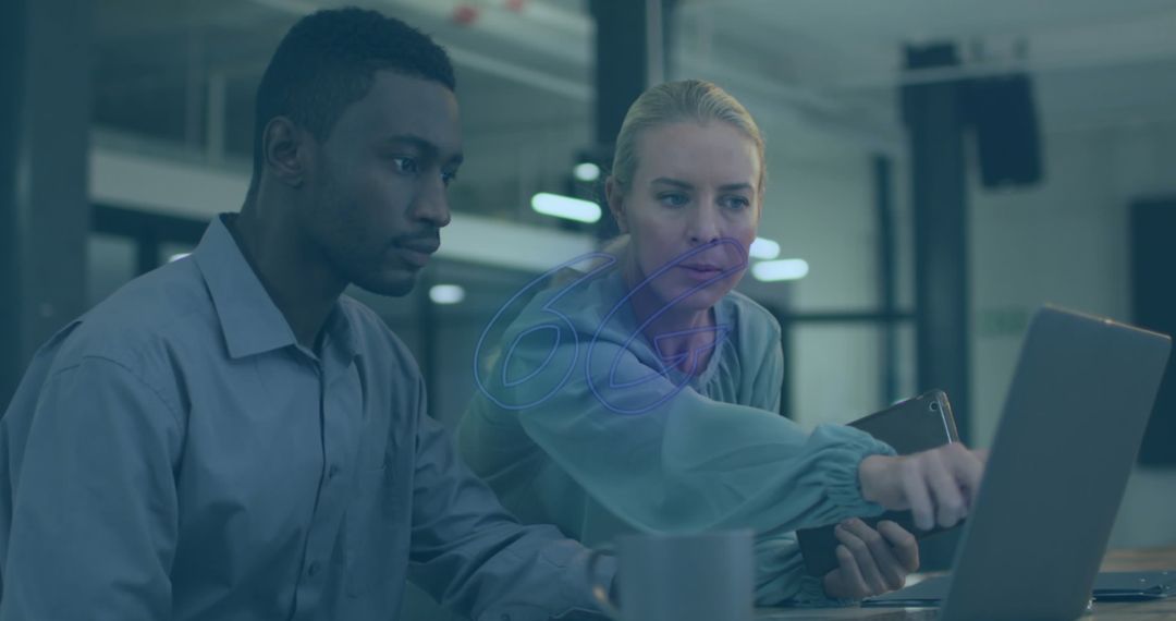 Team Collaboration in Modern Office Setting with Technology