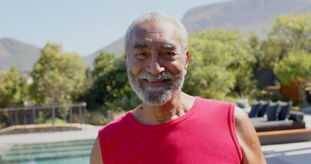 Smiling Elderly Man by Poolside on Sunny Day - Free Images, Stock Photos and Pictures on Pikwizard.com