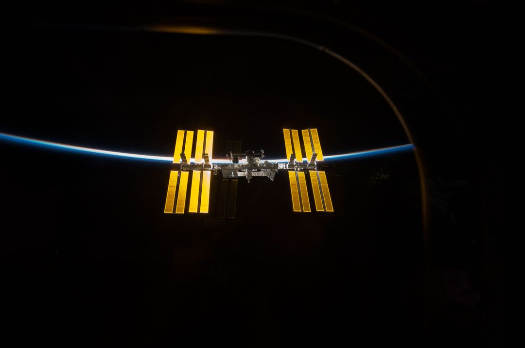 International Space Station backdropped by Earth and space - Free Images, Stock Photos and Pictures on Pikwizard.com