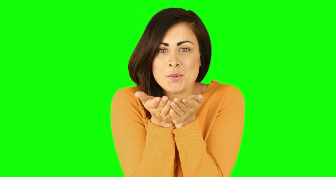 Woman Blowing Kiss Gesture on Green Screen Background - Free Images, Stock Photos and Pictures on Pikwizard.com