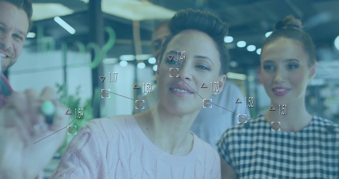 Innovative Team Collaborating on Digital Interface in Modern Office