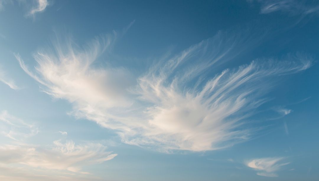 Wispy Cirrus Clouds Against Blue Sky