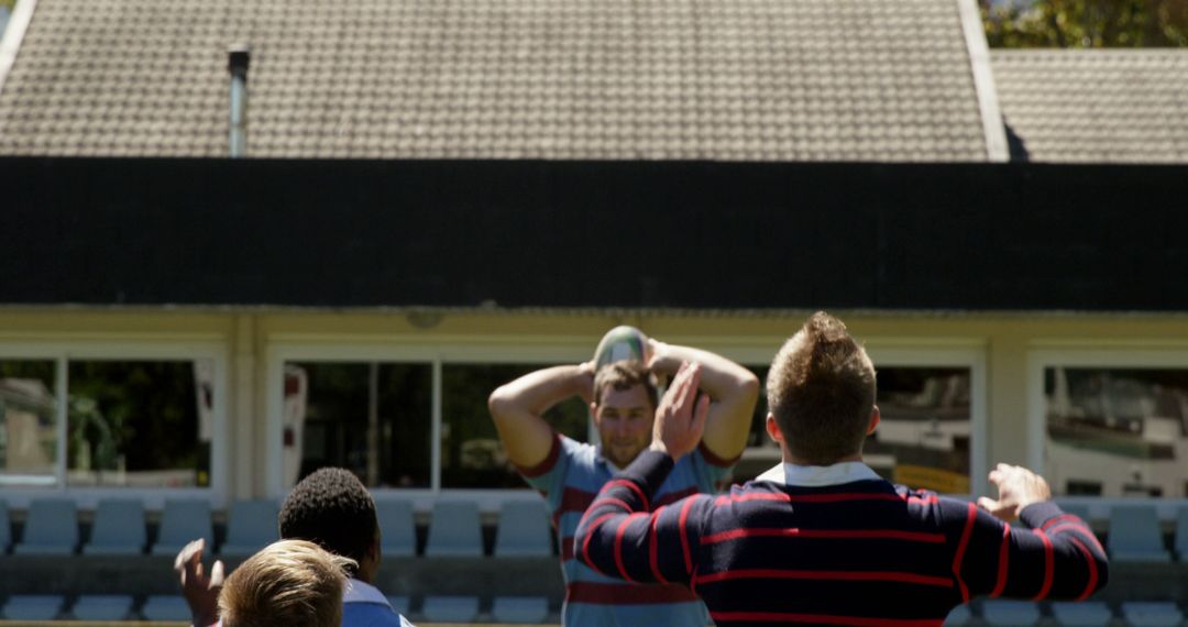 Rugby Players on Field Practicing Line-Out Skills - Free Images, Stock Photos and Pictures on Pikwizard.com