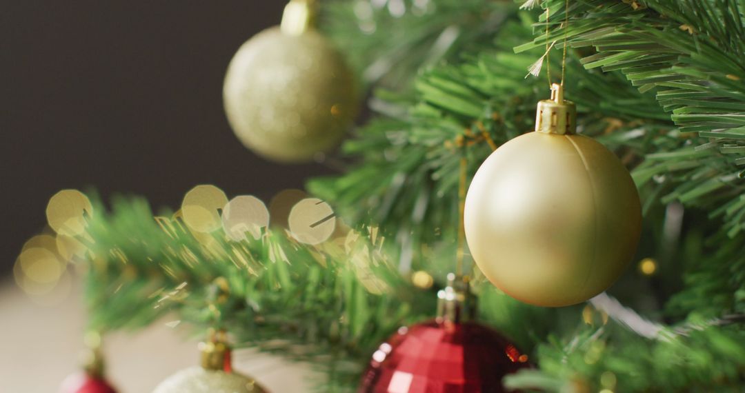 Glowing Christmas Tree with Gold and Red Baubles