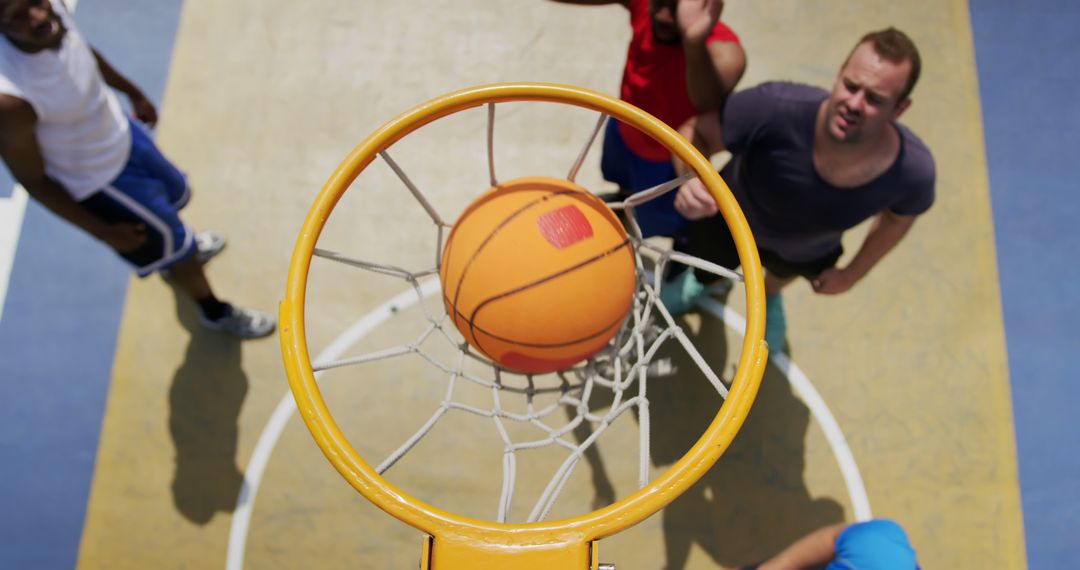 Basketball Players in Action Shooting at Open Hoops
