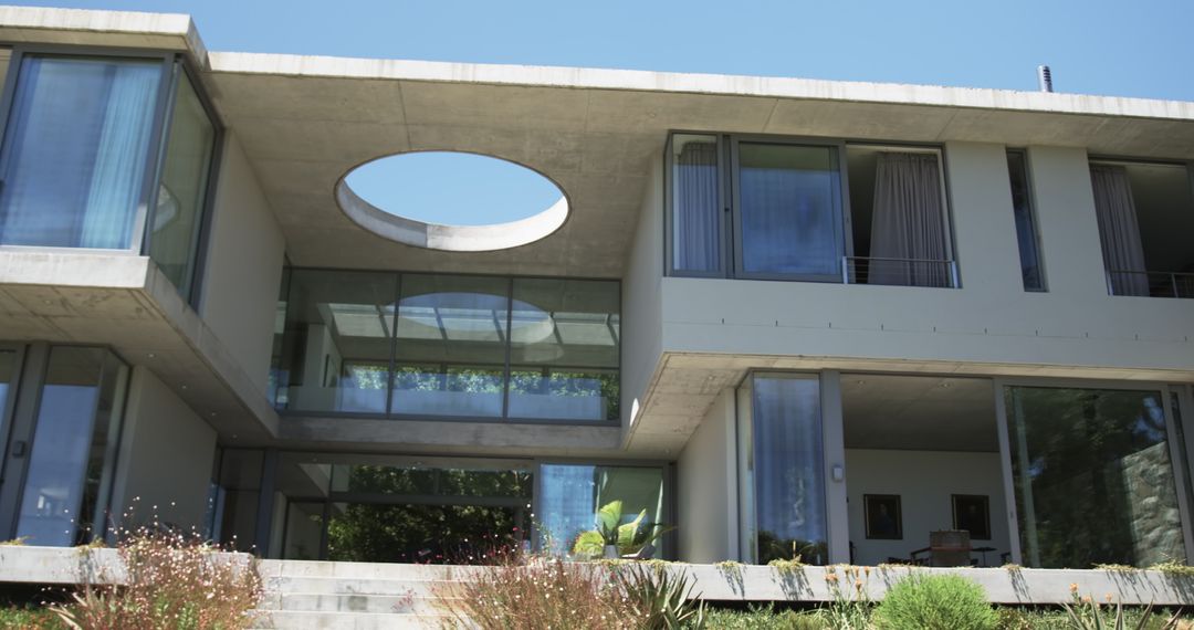 Modern House with Large Glass Windows and Circular Architecture