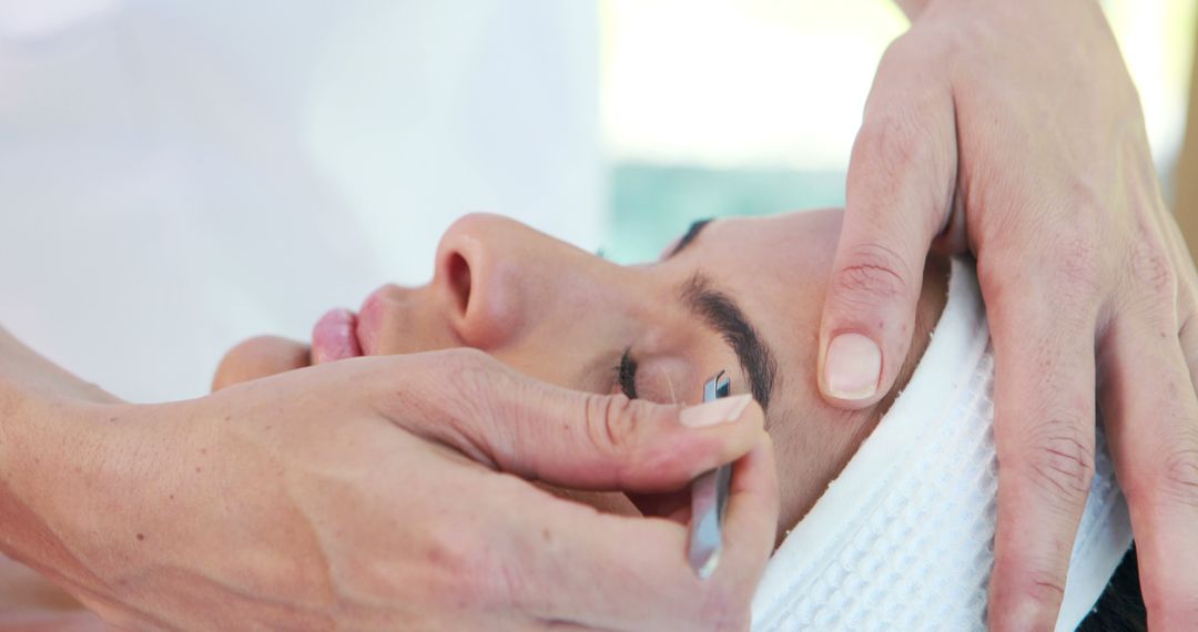 Woman Receiving Eyebrow Plucking Beauty Treatment - Free Images, Stock Photos and Pictures on Pikwizard.com