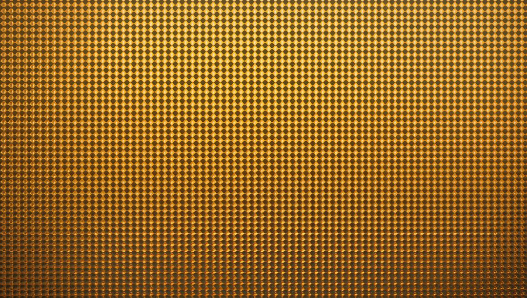 Shimmering Gold Honeycomb Metal Panel with Studded Texture and Warm Gradient Lighting