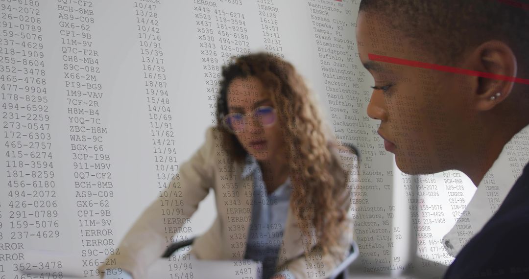 Business Professionals Analyzing Data Projections in Modern Office