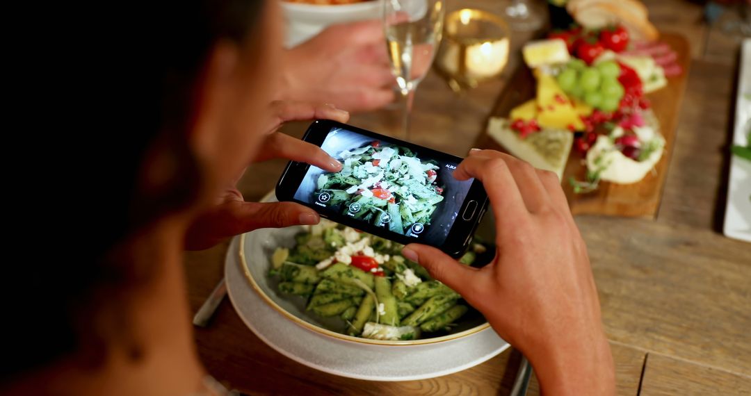 Person Taking Photo of Salad at Dinner Table - Free Images, Stock Photos and Pictures on Pikwizard.com