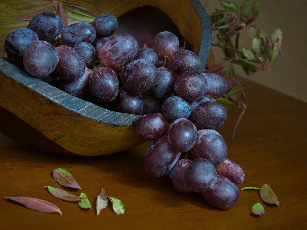 Fresh Red Grapes in Rustic Wooden Bowl