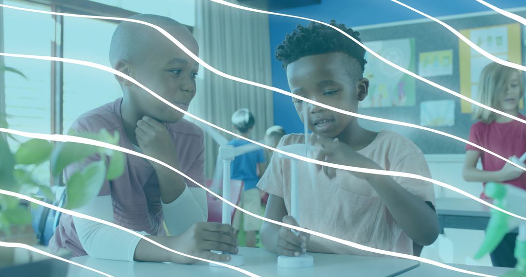 Elementary students conducting hands-on science experiment with droppers and vials