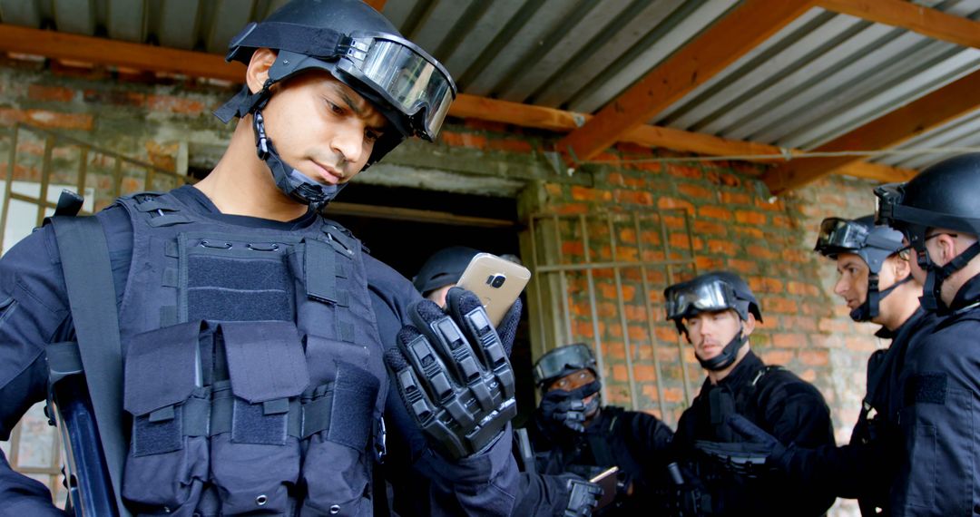 Tactical Police Team Using Smartphone during Operation - Free Images, Stock Photos and Pictures on Pikwizard.com