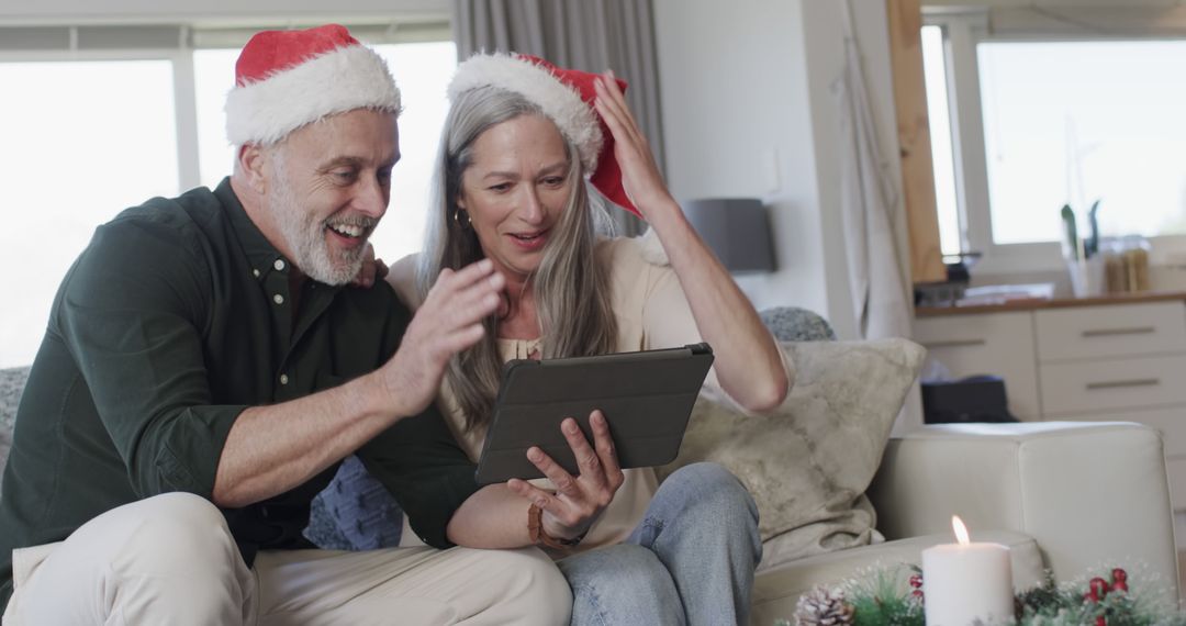 Older Couple Video Calling Family During Christmas Celebration - Free Images, Stock Photos and Pictures on Pikwizard.com