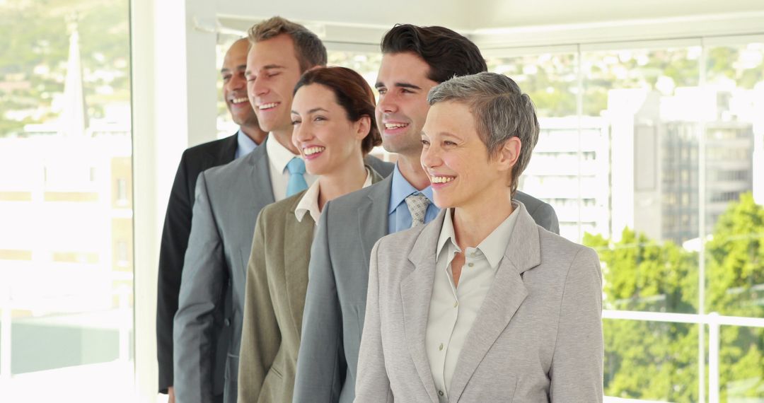 Confident Multiracial Business Team Smiling in Bright Office - Free Images, Stock Photos and Pictures on Pikwizard.com