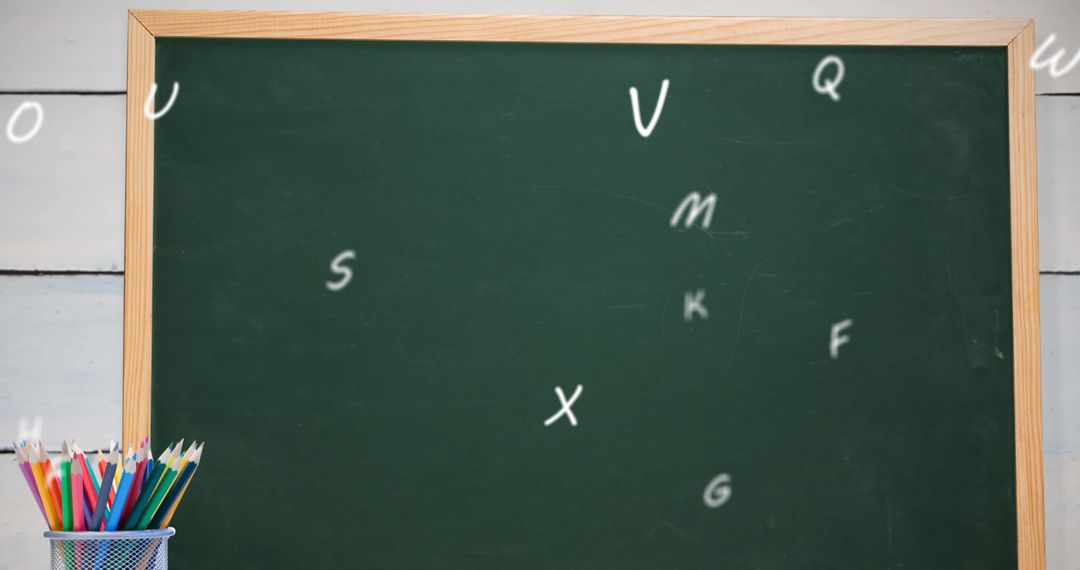 Colorful Pencils and Blackboard with Floating Letters